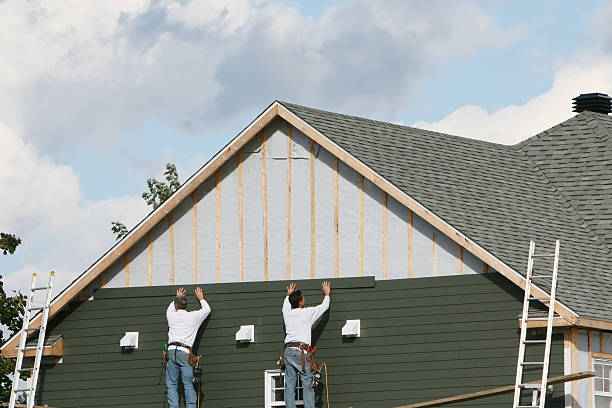 Professional Storm Damage Siding Repair technician working in Dayton, MN